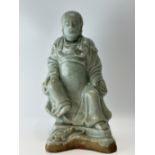 A Chinese porcelain figure, 17TH/18TH Century Pr. 