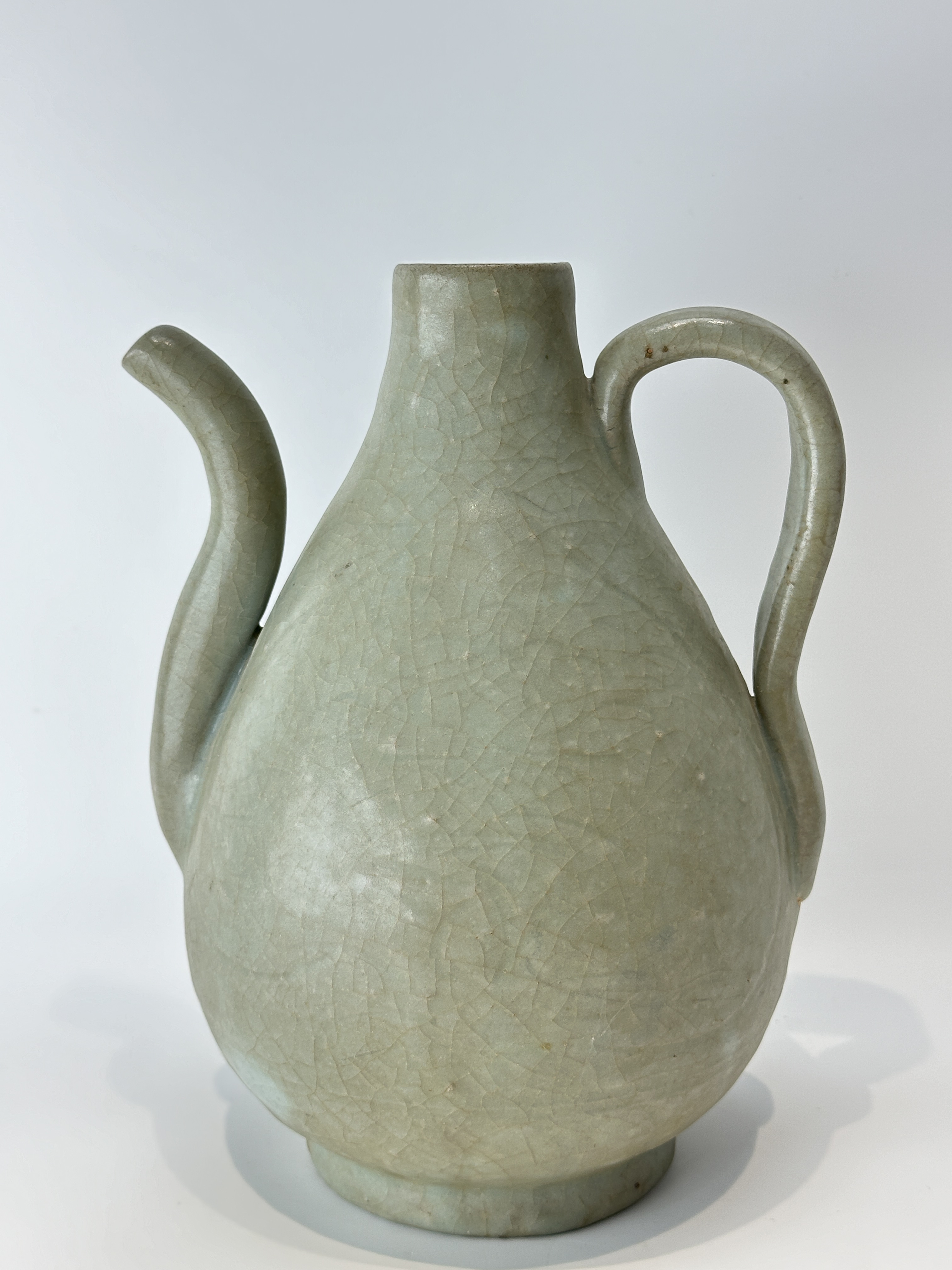 A Chinese celadon teapot, 16TH/17TH Century Pr. 