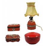 4 different ceramic and porcelain objects, objects decorated with handmade coloring on a red
