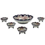 Japanese porcelain set, decorated with folklore prints and hand painted, the bowls are signed. The