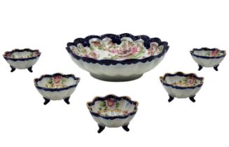 Japanese porcelain set, decorated with folklore prints and hand painted, the bowls are signed. The