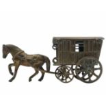 Desk box made of brass, designed as a horse-drawn carriage, the roof of the carriage opens.