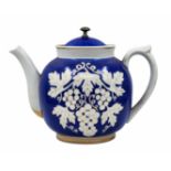 A large Russian (Soviet) teapot, made of decorated porcelain and matching lid, signed. Height: 28