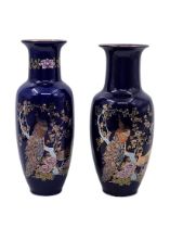 2 Japanese porcelain jugs, decorated with peacock and plant prints on a cobalt blue and gold