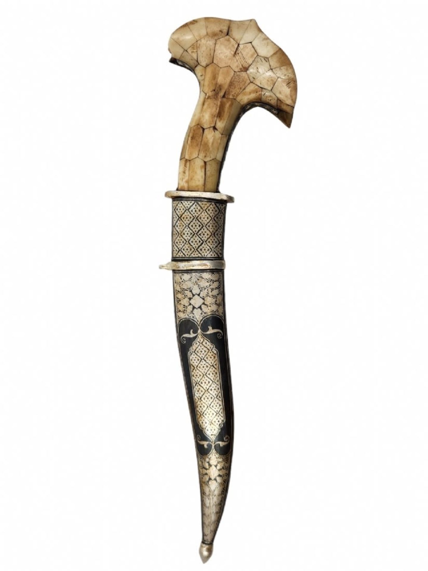 Decorative dagger, made of metal and bone. Length: 40 cm. Width: 10 cm. Period: 20th century