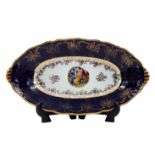 Czech serving dish, oval, made of porcelain, decorated with a print and gold decorations on a cobalt