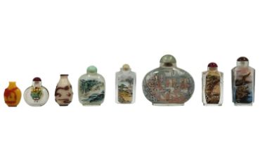 8 Chinese Snuff Bottles, decorative bottles, made of glass. Six of them are decorated on the