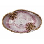 Ceramic bowl, oval bowl, decorated with a pink lace print and plaited braid with gold remnants,