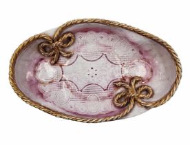 Ceramic bowl, oval bowl, decorated with a pink lace print and plaited braid with gold remnants,