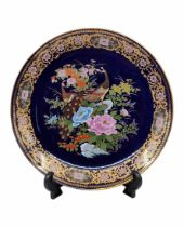 A large Japanese porcelain plate, decorative, decorated with a print of peacocks, flowers and gold