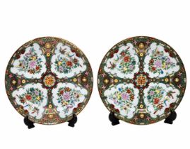 A pair of Chinese porcelain plates, decorative plates, enamel design in classic Cantonese Mandarin
