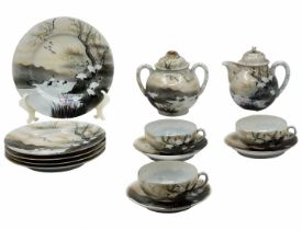 Parts of a Chinese porcelain set, decorated with printed and handmade nature illustrations,