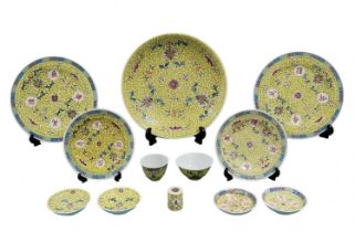 Parts of a Chinese porcelain set, 'Longevity' model (Mun Shou), yellow, decorated with enamel,