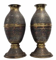 A pair of Islamic vases, decorative Islamic vases, made of Damascus work (inlay of copper and silver