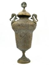 An antique Islamic jug, Mughal Empire period, with matching lid, made of richly decorated brass,
