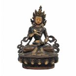 An antique Buddhist statue, approximately hundred years old, made of brass and decorated with