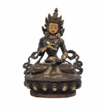An antique Buddhist statue, approximately hundred years old, made of brass and decorated with