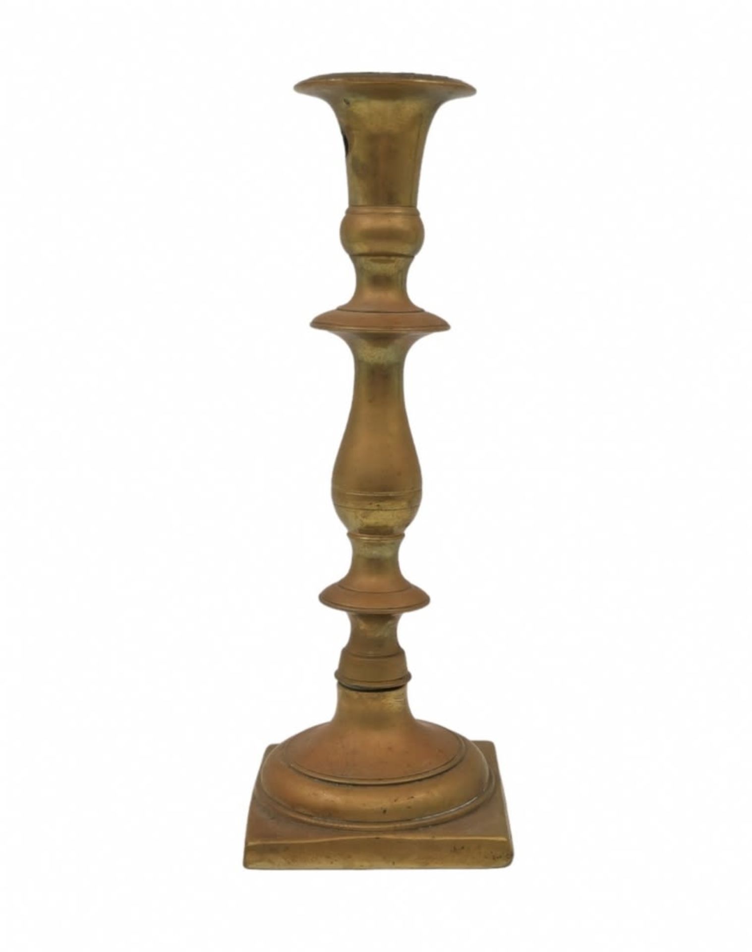 An antique Jewish candlestick from the 18th century, made of bronze (two parts), converted in the