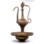 An antique 19th century Syrian Aftaba and matching stand (basin and strainer), made of sawn brass
