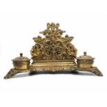 A beautiful antique double desk inkwell, apparently French, made of cast brass, two wells, paper