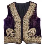An antique 19th century Ottoman waistcoat, made of fabric embroidered with gold threads,