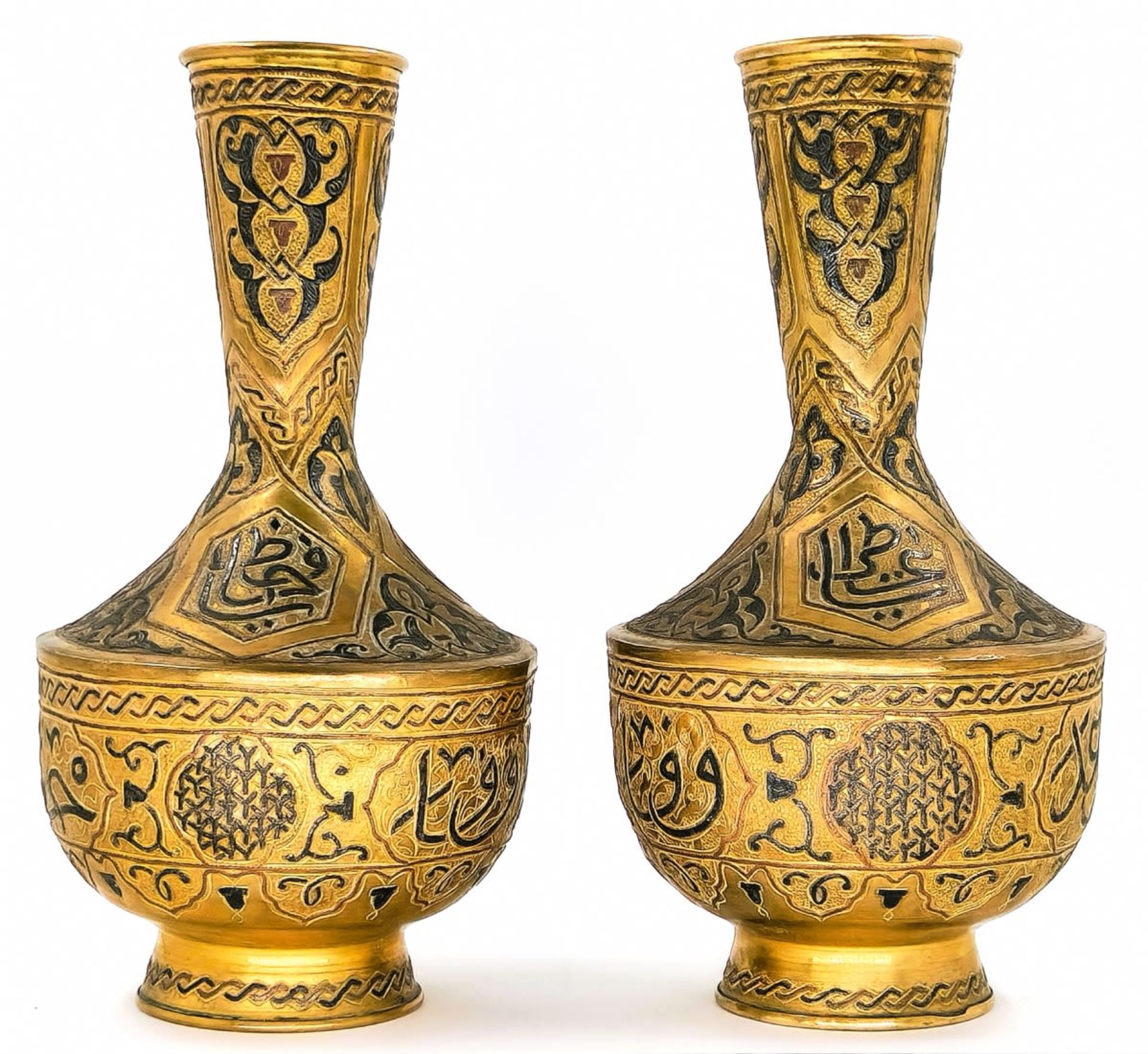 A pair of Islamic vases, decorated with 'Damascus work' (inlay of copper and silver in a brass), - Image 2 of 4