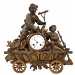 Antique French mantle clock made of spelter (gilded), sculpted in the form of two boys on a hay