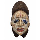 Antique tribal African mask, Punu people of Gabon, from the first third of the 20th century, made of