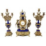 Antique Italian garniture, made of brass and blue porcelain, includes a mantle clock and two