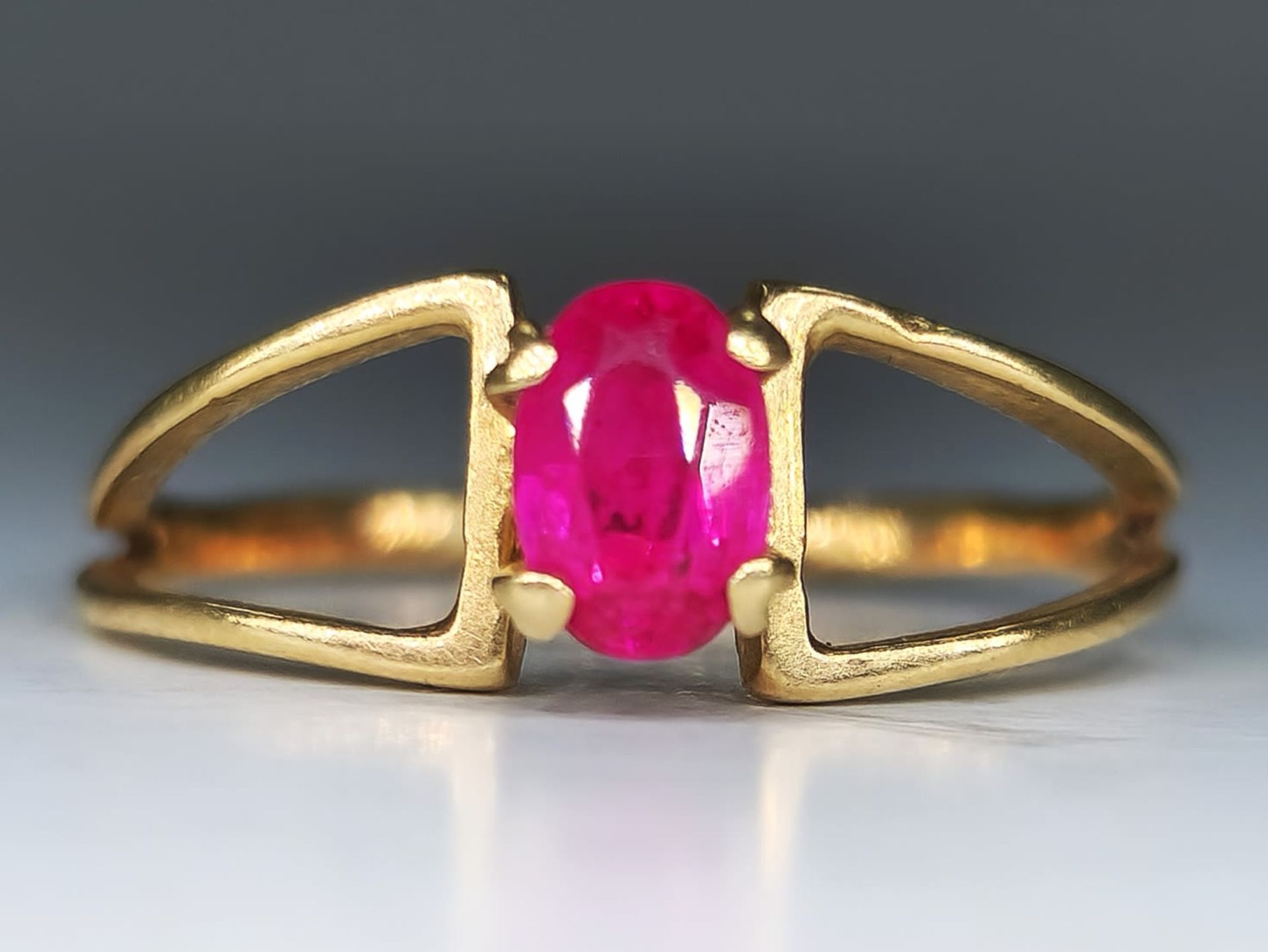 A 14K gold ring with a red 'Rubellite' stone, not signed but the purity of the gold has been tested,