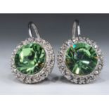 A pair of earrings plated with white gold with zirconia, unsigned, Diameter: 1.3 cm, Height