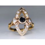 14K antique gold ring embedded with a blue sapphire and diamonds, signed, embedded in the center