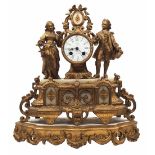 Antique mantle clock from the 19th century, apparently French, made of gold-painted spelter and