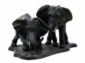 'A pair of elephants' - a large bronze statue, brown patina, unsigned Height: 36 cm, Base