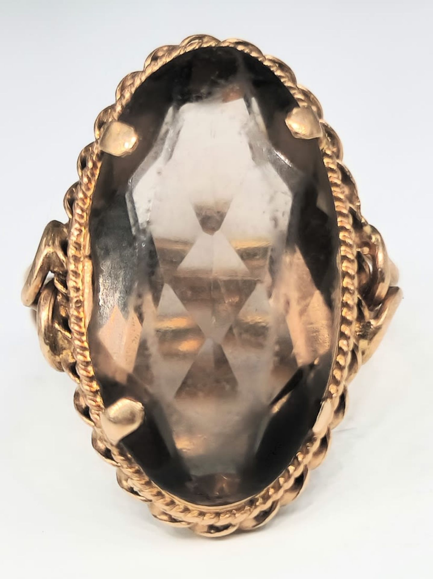 A retro 14K gold ring with a polished smoky quartz stone, signed, Total weight: 5.32 grams in total,
