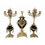 Antique French Garniture, impressively large and luxurious, includes a mantle clock and a pair of