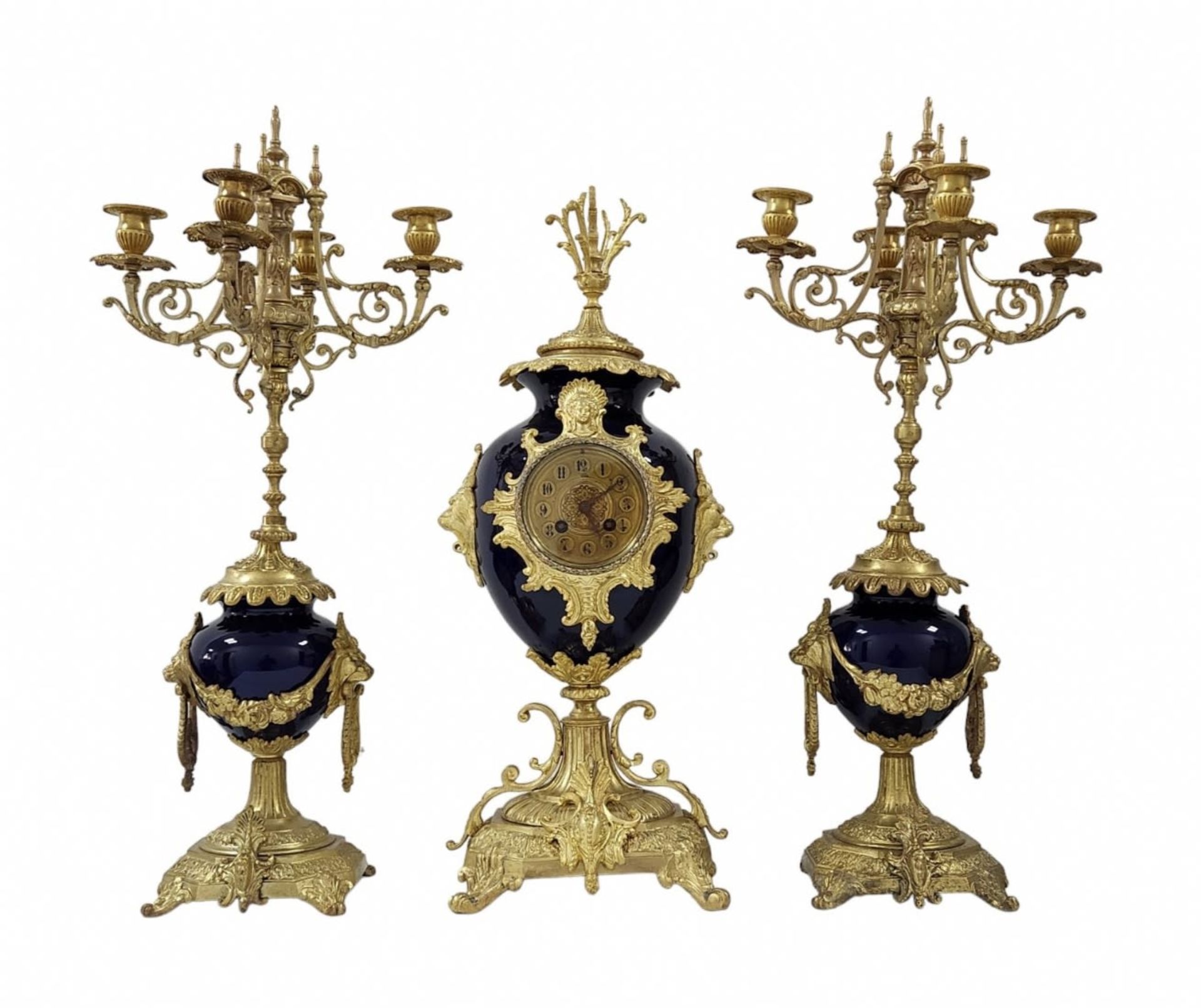 Antique French Garniture, impressively large and luxurious, includes a mantle clock and a pair of