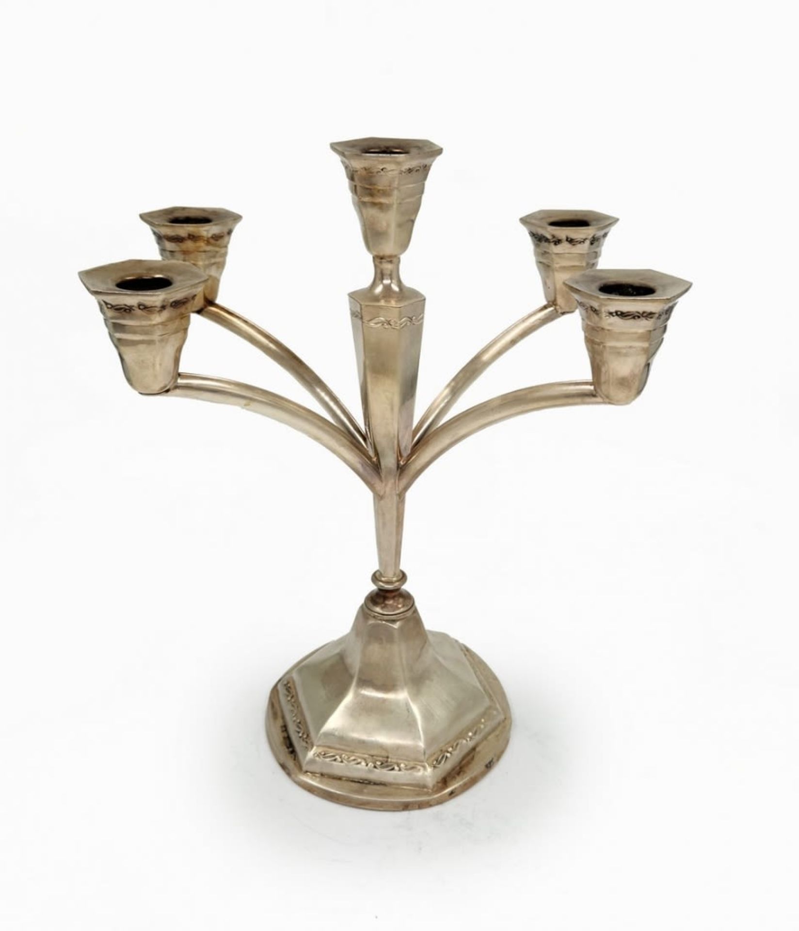 A silver candlestick for five candles, made by the 'Hazorifim' company, made of '800' silver,
