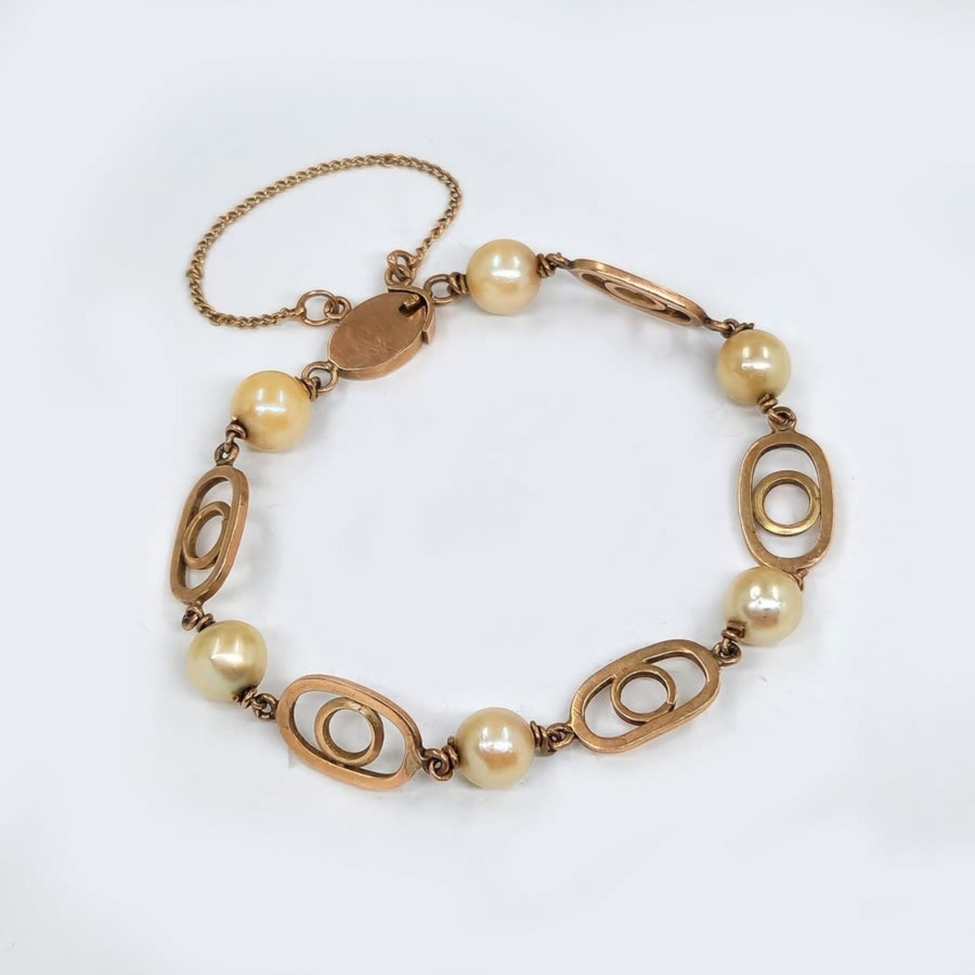 An antique bracelet of 14K yellow gold with pearls, not signed but the purity of the gold has been