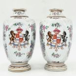 A pair of antique French porcelain jugs made by 'Edme Samson', decorated with enameled and signed