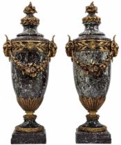 A pair of heavy and impressive French vases in the Louis XVI style, made of natural marble and