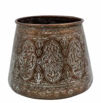 An antique Islamic vessel from the 19th century, made of brass, decorated with an artist's hand