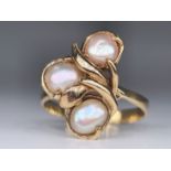 A 14K gold ring with three pearls, the seal is very worn, but the purity of the gold has been