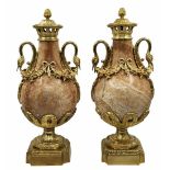 A pair of heavy and impressive French vases in the Louis XVI style, made of natural marble and