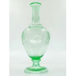 An antique 19th century decanter, green Uranium glass, with hand-engraved decorations and a monogram