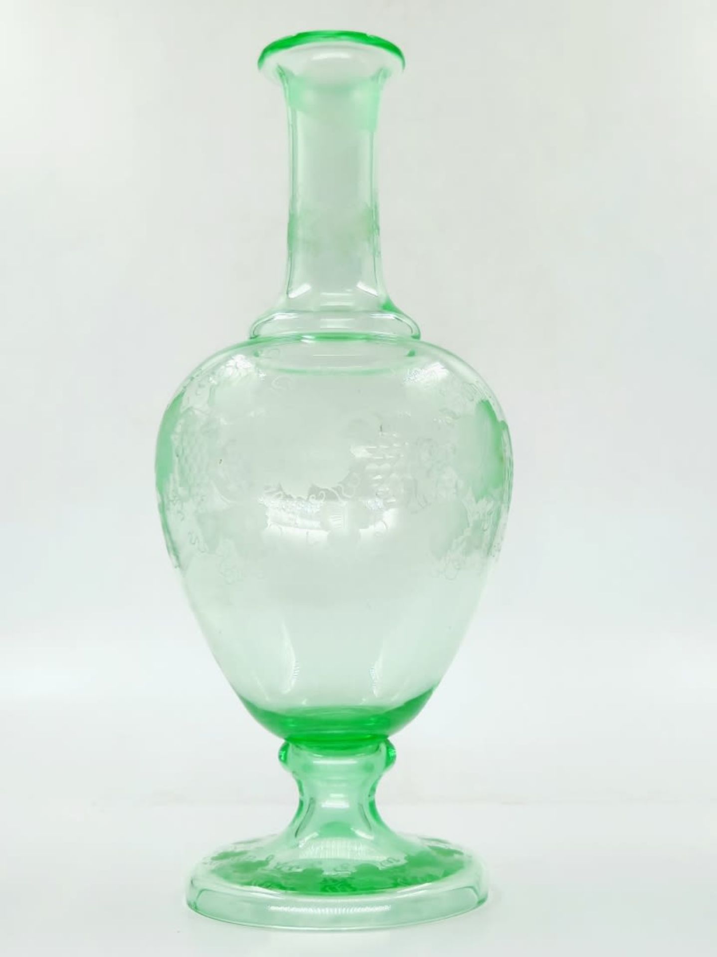 An antique 19th century decanter, green Uranium glass, with hand-engraved decorations and a monogram