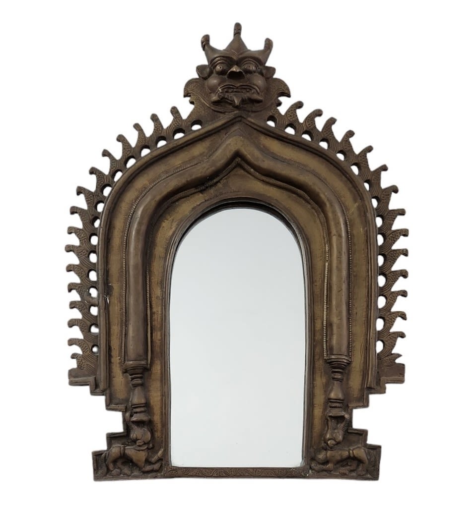 A massive and very heavy Indian mirror, made of bronze, Width: 33 cm, Height: 43 cm. Period: 20th