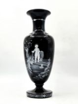 An antique English (Victorian) glass vase, made by 'Mary Gregory Glass', made of black 'onyx