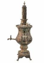 A large and impressive Moroccan samovar, silver plated metal in Repousse work, in the Neo-Rococo