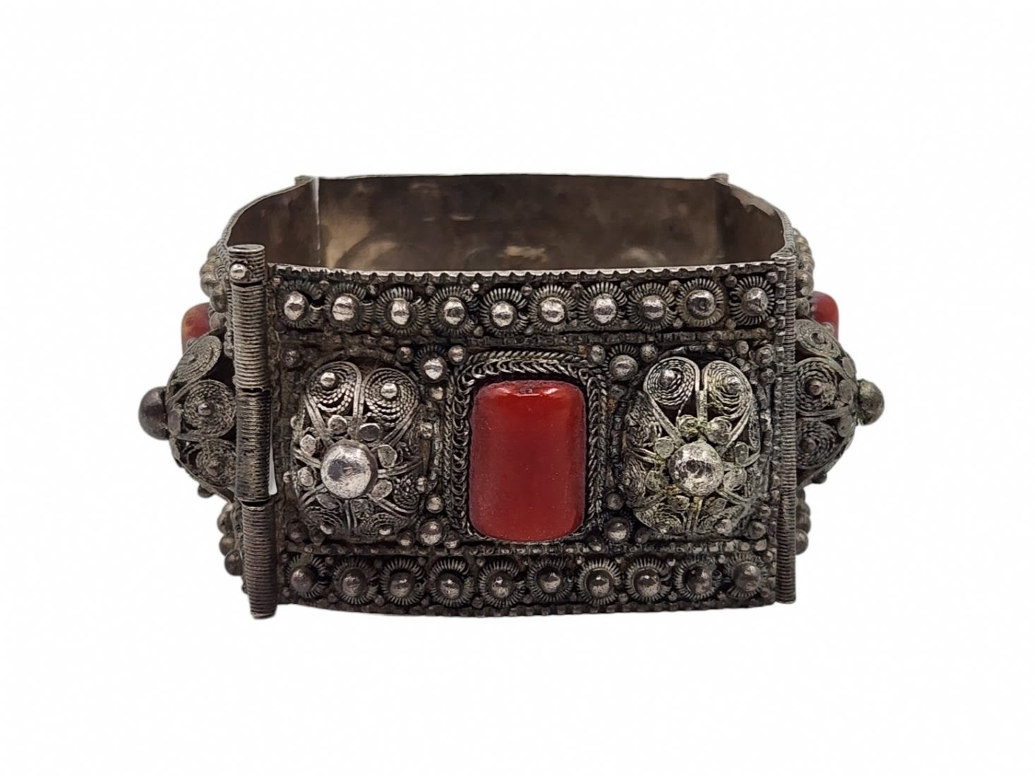 An antique silver bracelet with delicate and high-quality filigree work, combined with amber